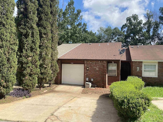 3722 Sutor Ct, Tallahassee, FL 32311 - view of front of home featuring brick siding, concrete driveway, an attached garage, and roof with shingles