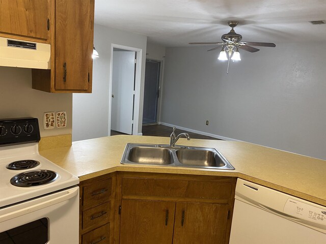 3722 Sutor Ct, Tallahassee, FL 32311 - kitchen featuring white appliances, range hood, light countertops, a ceiling fan, and brown cabinets
