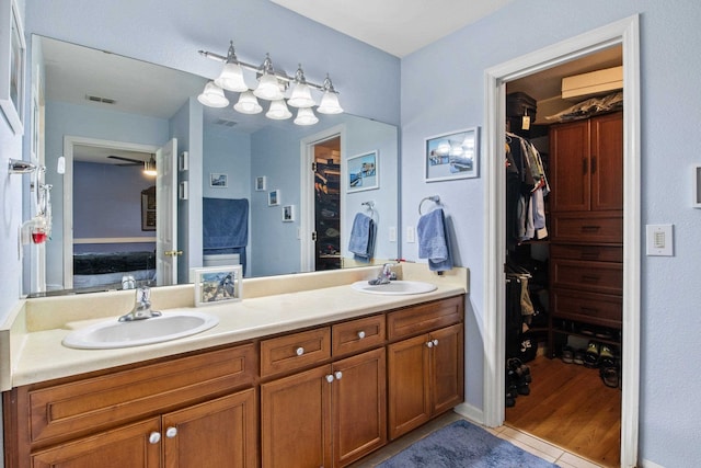 3224 Lord Murphy Trl, Tallahassee, FL 32309 - bathroom featuring double vanity, a sink, and a walk in closet
