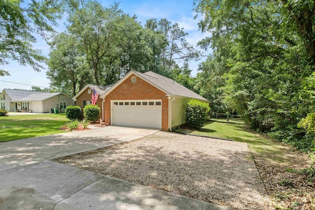3224 Lord Murphy Trl, Tallahassee, FL 32309 - view of front of home with a garage, a front yard, brick siding, and driveway