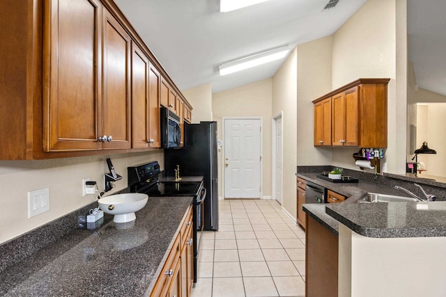 3224 Lord Murphy Trl, Tallahassee, FL 32309 - kitchen featuring a sink, brown cabinetry, light tile patterned flooring, black appliances, and vaulted ceiling