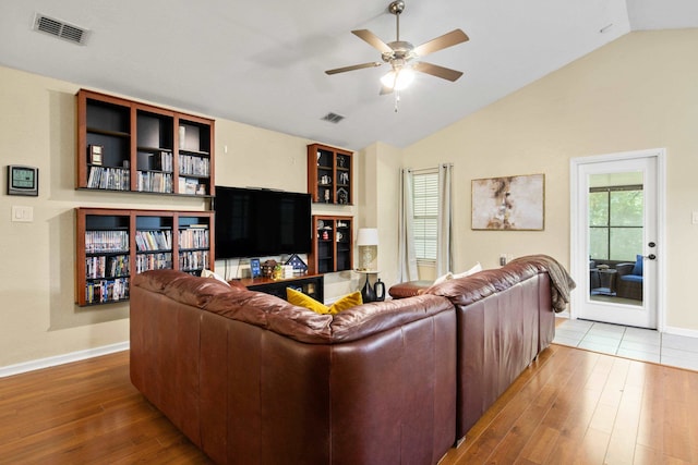 3224 Lord Murphy Trl, Tallahassee, FL 32309 - living area featuring wood finished floors, visible vents, and vaulted ceiling