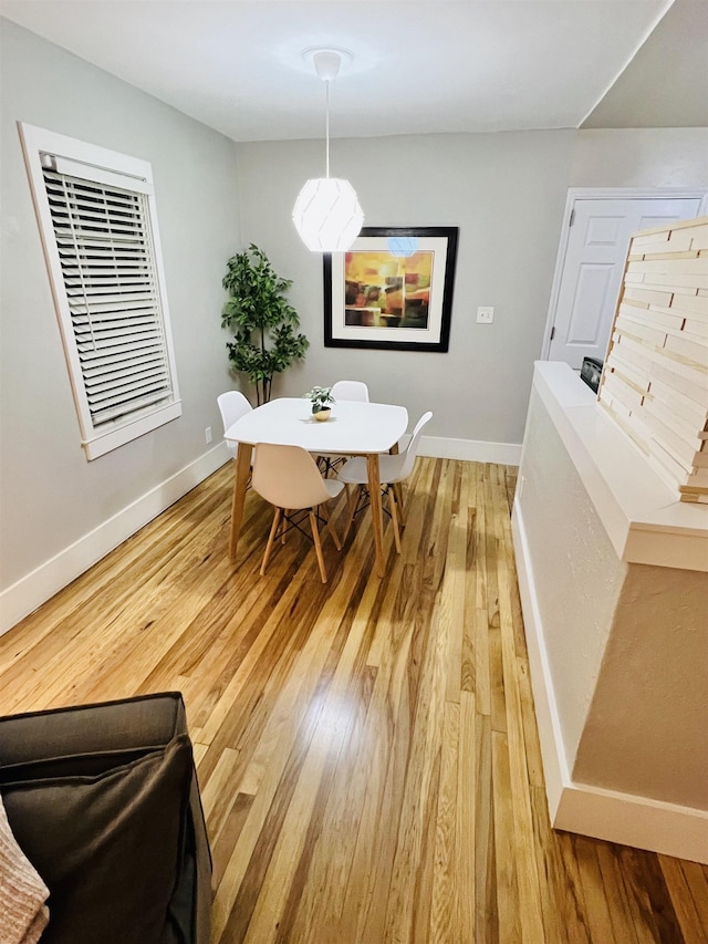 dining area with hardwood / wood-style flooring