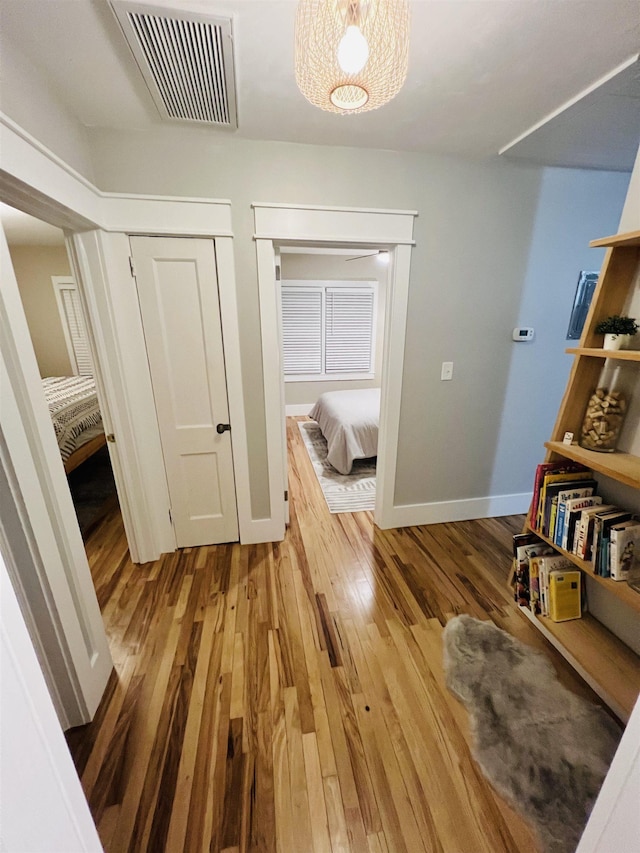 corridor featuring hardwood / wood-style floors