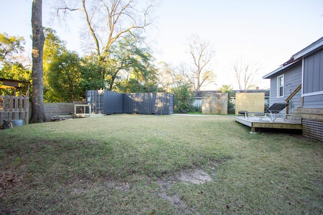 view of yard with a wooden deck