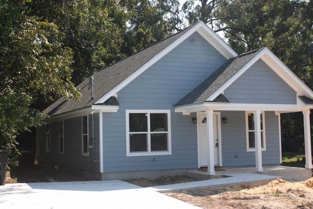 2511 Saxon St, Tallahassee, FL 32310 - bungalow with a porch and roof with shingles