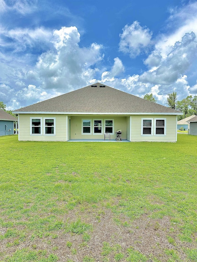 63 Windsor Way, Crawfordville, FL 32327 - rear view of house with a yard and a patio area
