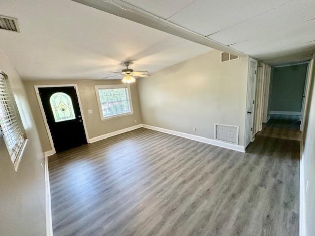 foyer entrance with wood-type flooring and ceiling fan