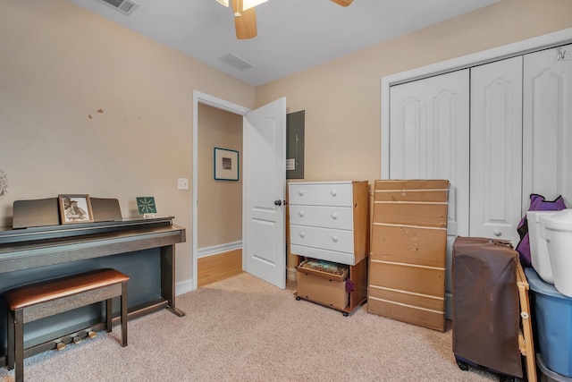 miscellaneous room featuring ceiling fan and light colored carpet