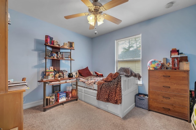 bedroom featuring ceiling fan and light colored carpet