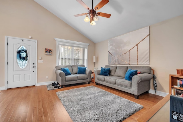 living room featuring wood-type flooring, high vaulted ceiling, and ceiling fan