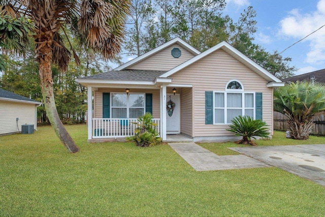 bungalow-style house with a porch, central AC, and a front lawn