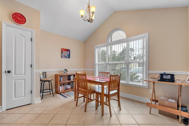 dining area with an inviting chandelier, vaulted ceiling, and light tile patterned floors