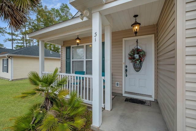 entrance to property featuring a porch