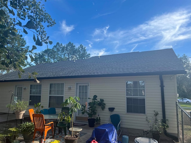 back of house with a patio