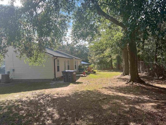 view of yard with central AC