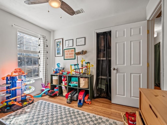 rec room with ceiling fan and wood-type flooring