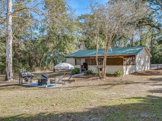 exterior space with a front yard and a patio