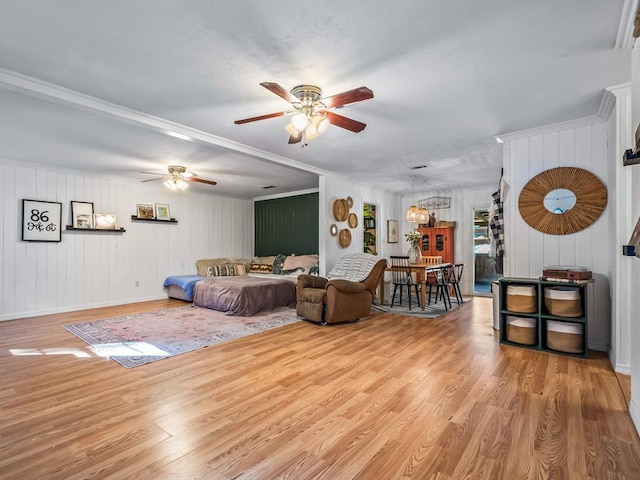 living room with ceiling fan and light wood-type flooring