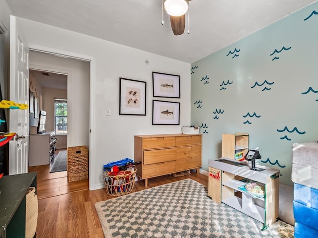 interior space featuring hardwood / wood-style floors and ceiling fan