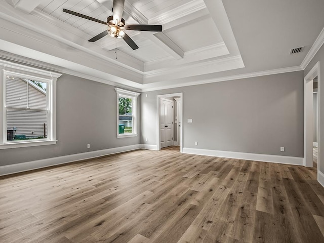 empty room with crown molding, hardwood / wood-style flooring, coffered ceiling, and ceiling fan