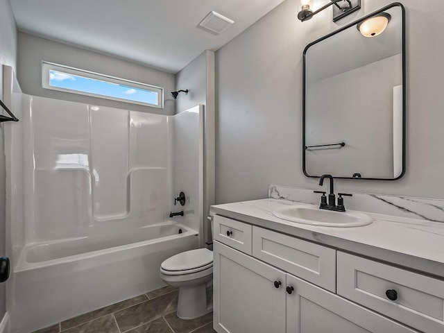 full bathroom featuring shower / tub combination, vanity, toilet, and tile patterned flooring