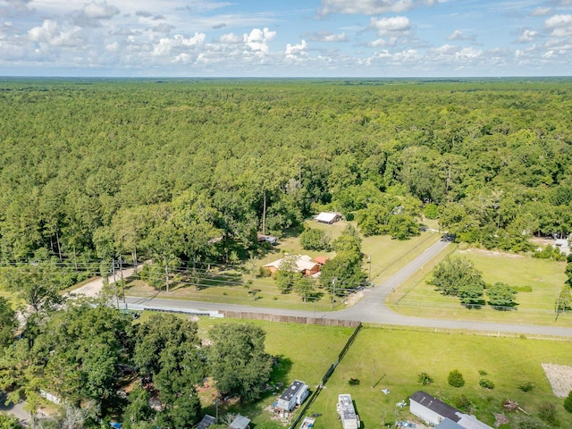 birds eye view of property with a wooded view