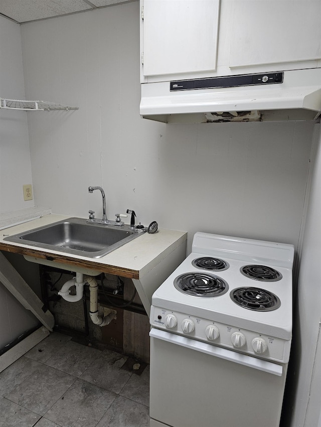 kitchen with white range with electric stovetop, light countertops, white cabinets, tile patterned flooring, and under cabinet range hood