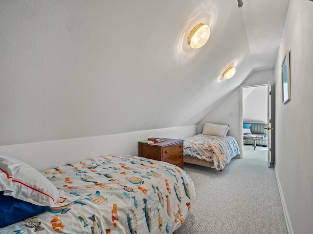 carpeted bedroom featuring vaulted ceiling