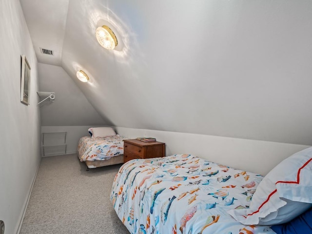 carpeted bedroom featuring vaulted ceiling