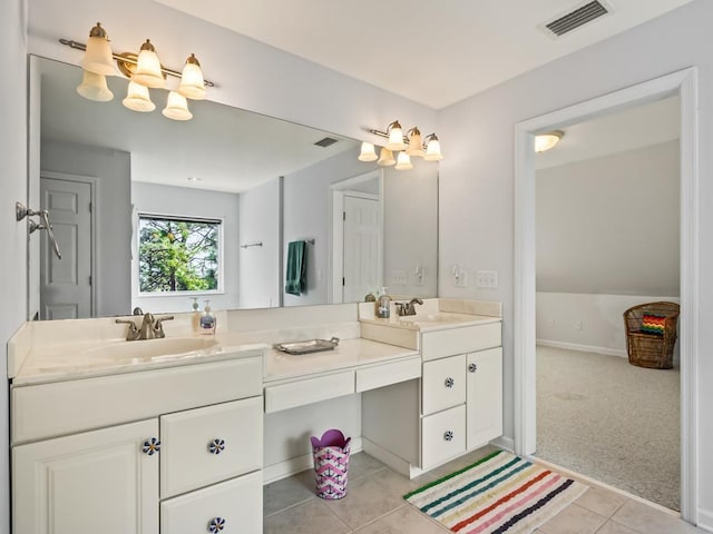 bathroom featuring tile patterned flooring and vanity