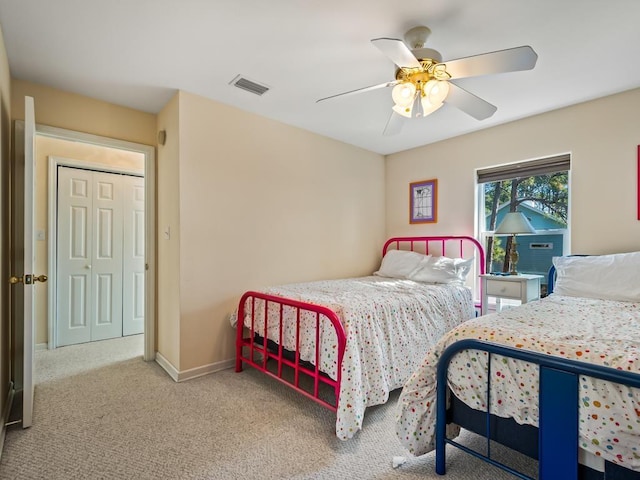 bedroom with carpet flooring, ceiling fan, and a closet