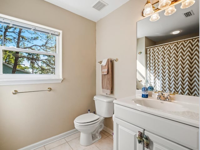 bathroom with toilet, vanity, tile patterned floors, and a shower with shower curtain