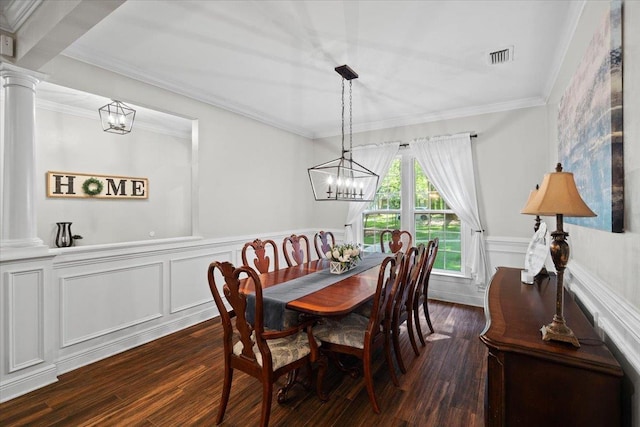 9816 Thunder Hill Trl, Tallahassee, FL 32312 - dining area with ornate columns, dark wood finished floors, a wainscoted wall, a chandelier, and ornamental molding