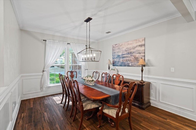 9816 Thunder Hill Trl, Tallahassee, FL 32312 - dining room featuring dark wood-type flooring, wainscoting, ornamental molding, and a chandelier