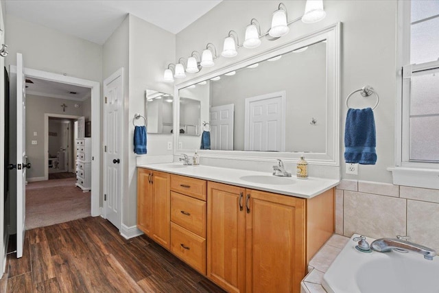 9816 Thunder Hill Trl, Tallahassee, FL 32312 - full bath featuring double vanity, a garden tub, and wood finished floors