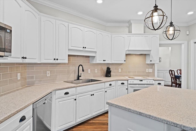 9816 Thunder Hill Trl, Tallahassee, FL 32312 - kitchen with appliances with stainless steel finishes, white cabinetry, ornamental molding, custom exhaust hood, and hanging light fixtures