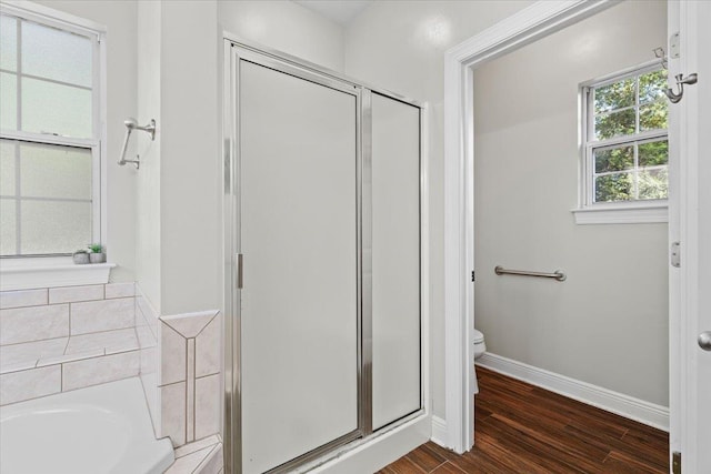 9816 Thunder Hill Trl, Tallahassee, FL 32312 - full bath featuring a stall shower, wood finished floors, and a bath