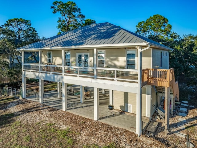 back of property with french doors and a patio