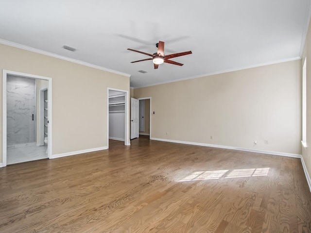 unfurnished bedroom featuring hardwood / wood-style floors, ceiling fan, a closet, and ornamental molding