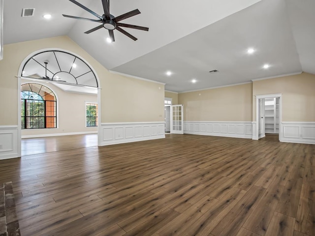 unfurnished living room with dark wood-type flooring, vaulted ceiling, and ornamental molding