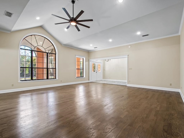 empty room with dark hardwood / wood-style flooring, ceiling fan, vaulted ceiling, and ornamental molding