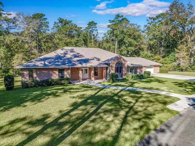 ranch-style home with a front yard