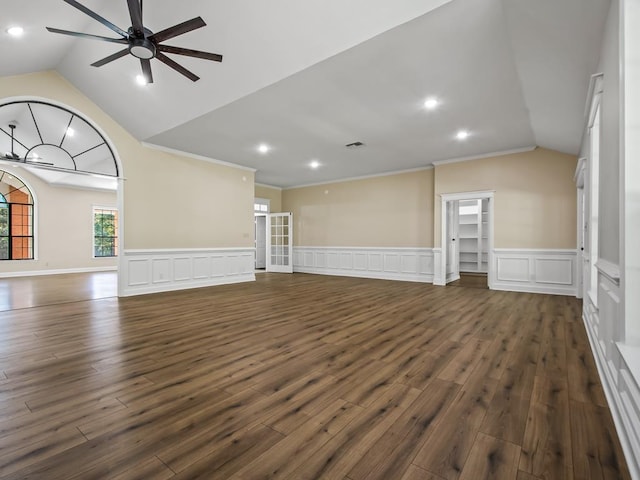 unfurnished living room with ornamental molding, dark hardwood / wood-style flooring, lofted ceiling, and ceiling fan