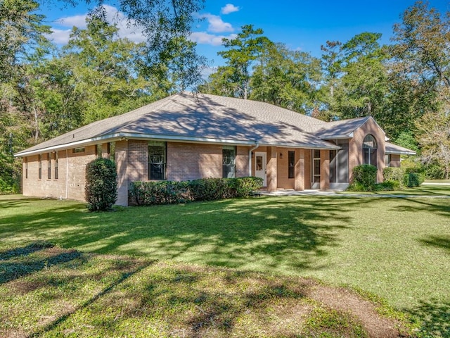 ranch-style house with a front lawn