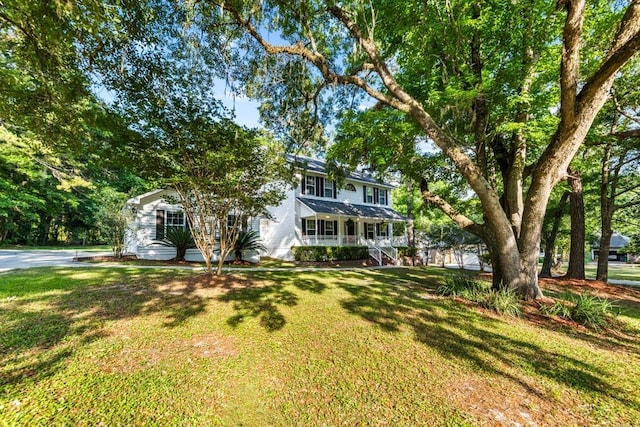 view of front of house featuring a front lawn and a porch