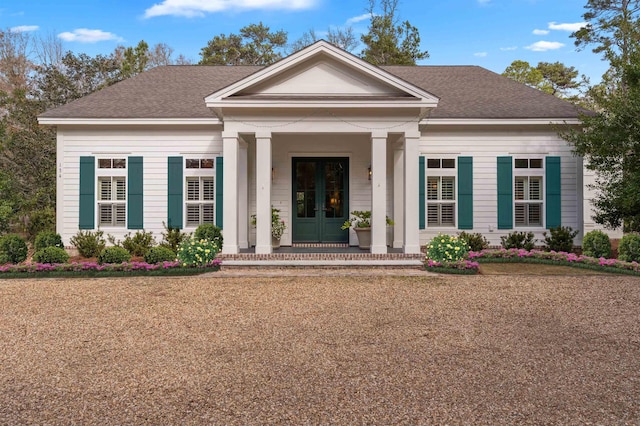 neoclassical / greek revival house with a shingled roof