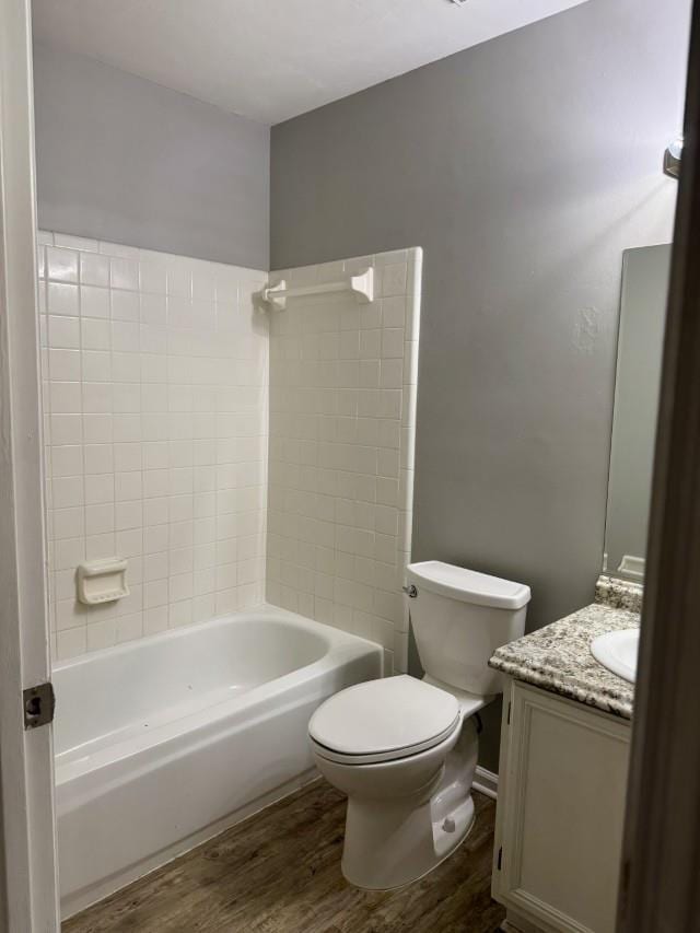 full bathroom featuring shower / bath combination, vanity, toilet, and wood-type flooring