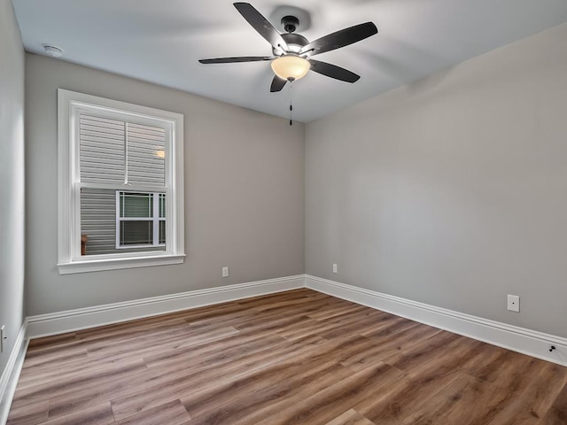 27 Spokan Trl, Crawfordville, FL 32327 - spare room with wood finished floors, ceiling fan, and a smoke detector