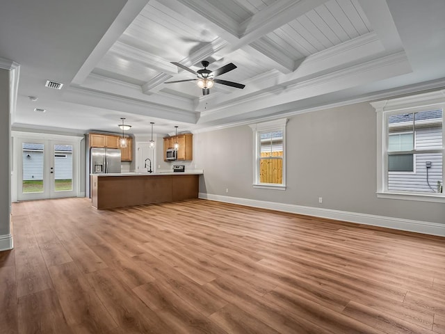 27 Spokan Trl, Crawfordville, FL 32327 - unfurnished living room featuring light wood-type flooring, crown molding, ceiling fan, beam ceiling, and coffered ceiling